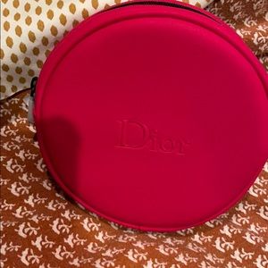 Dior makeup bag.  Round with zipper